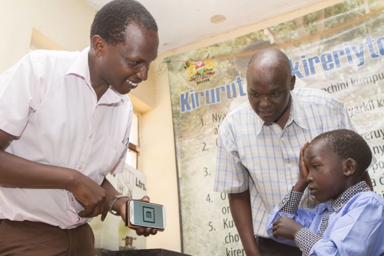 After receiving eye surgery, seven-year-old Allan had his vision checked using the PEEK smartphone application. “When I grow up, I would like to be a doctor so I can treat my people,” he says.