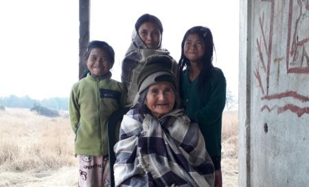 Indian woman with her grandchildren.